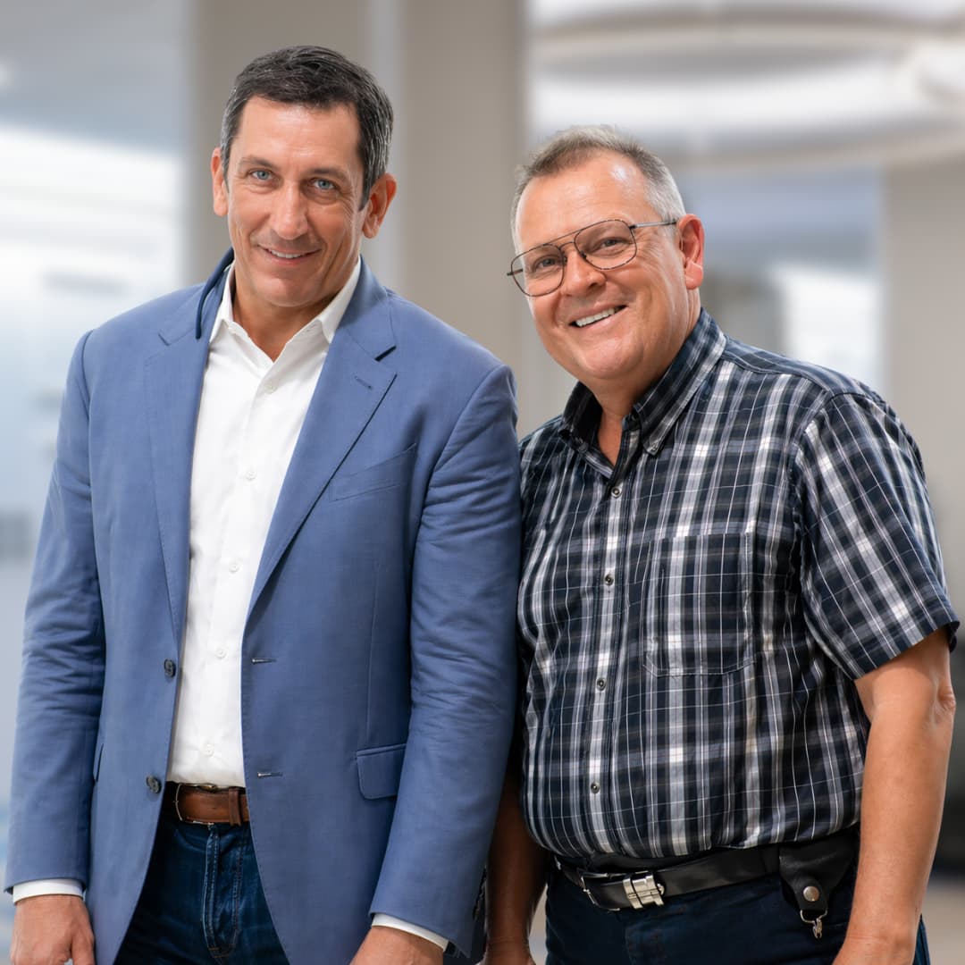 Carl White and Jim Reed standing side by side