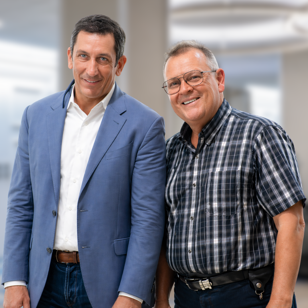 Carl White and Jim Reed standing side by side